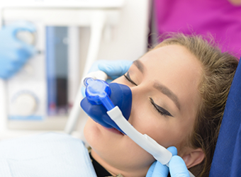 Woman with nitrous oxide nasal mask