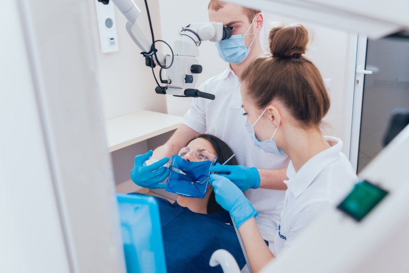 female patient receiving a root canal